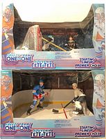 Both boxed sets stacked showing front packaging and figures