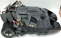 Left side perspective of Batmobile showing body detail and rear tire