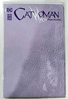Front cover full view showing purple leather variant Catwoman 80th Anniversary comic in bag and board