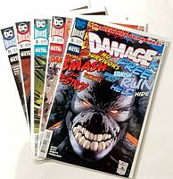 All five bagged Damage comic issues fanned out