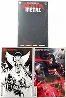Three bagged Dark Nights: Death Metal #1 variants arranged, showing all covers
