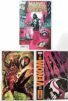 Front covers of Marvel Zombie #1, Venom #14 virgin variant, Venom #11 variant in protective sleeves