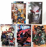Five DC Teen Titans/Titans comic books laid out