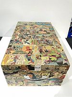 Angled top view of Marvel comic collage wooden storage box showing lid and overall design