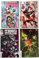 Group shot of four Teen Titans comic issues