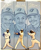 Front of box with player sketches and bobbleheads attached