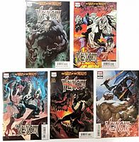 Five bagged and boarded Venom War of the Realms comics laid out