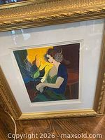 Front view showing framed print, matting and gold frame detail