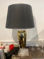 Full view of table lamp showing shade, body and base