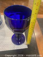 Goblet beside measuring tape showing 7 in height