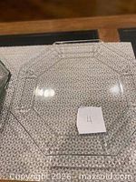 Close-up of one clear hexagonal glass plate