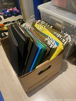Box filled with assorted-color legal hanging file folders