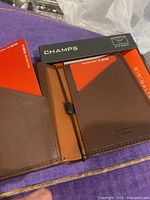 Interior view of brown Champs RFID minimalist wallet with box and RFID card inserts