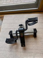 Overall view of pedal exerciser showing full frame and pedals