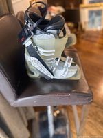 Full view of left boot showing shell color, buckles, heater battery pack