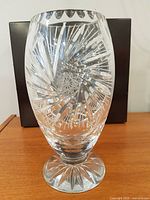 Footed cut crystal vase frontal view showing overall shape and patterns