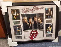 full framed display with group photo, four individual photos, logo and signatures