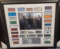Full framed display showing photo, tickets, plaque