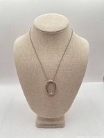 Full view of necklace on stand