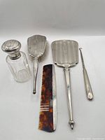 Full group view of all five vanity pieces