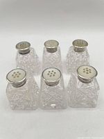 Six assembled shakers front view