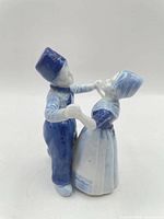 Front side of blue and white Delft-style porcelain Dutch couple figurine