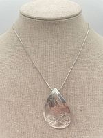 Pendant-brooch on mannequin showing overall size and chain