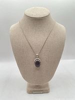 Full view of necklace on display bust