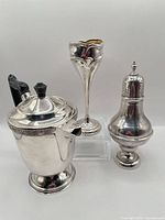 Group view of tea pot, bud vase and shaker