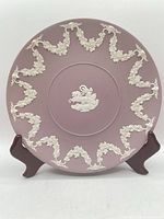 Front view of lavender jasperware plate on stand