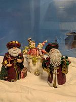 Group shot of three Christmas figurines