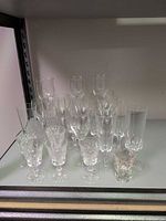 Group of assorted stemware on shelf