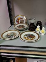 Group view of plates, mortar with pestle, insulators, and shakers