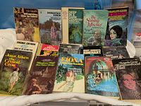 All 15 paperbacks displayed front covers