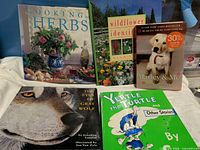 All five hardcover books displayed front covers visible