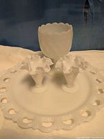 Overview of all four milk glass pieces on tray