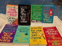 Front view showing all eight single books plus boxed set