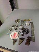 Overview of all watches, cufflinks, pins, collar tips, tie clip and chain