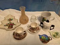 Group shot of all eleven kitchenware items displayed on white cloth