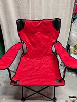 front view of red folding camping chair open