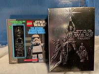 Front view showing Star Wars Trilogy slipcase next to Lego Stormtrooper Training Manual