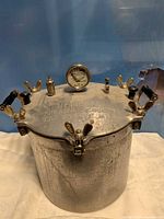 Full view of canner with lid, latches, handles and gauge