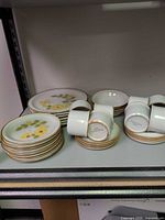 Stacks of plates, bowls and mugs showing overall set