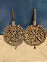 open waffle iron showing interior grid pattern