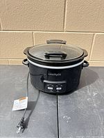 Front view of Crock-Pot slow cooker showing housing, controls, cord