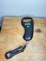 Full view of digital fishing scale with clamp