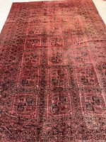 Full view of Afghan wool rug showing overall pattern and color