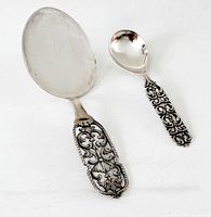 Front view of both spoons showing sizes and handle pattern