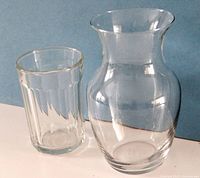 Both clear glass vases side by side