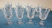All eight crystal pinwheel liqueur glasses front view